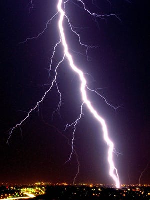 Lightning bolts strike the ground near Oklahoma City in this 2000 file photo.1