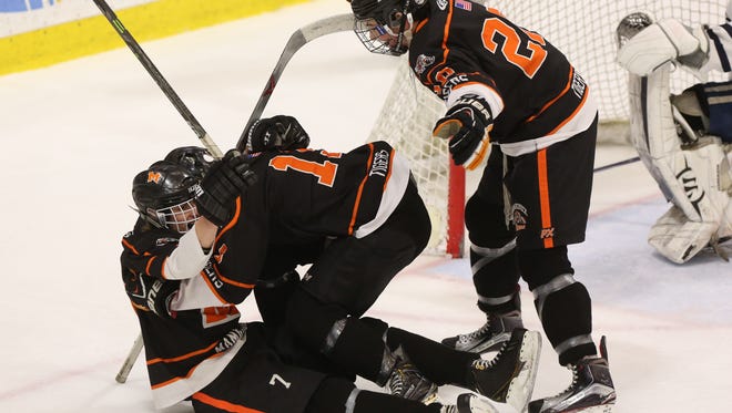 Mamaroneck's Alex Ewald  celebrates his opening goal with teammates Will Kirk (19) and Will Payne (20) during the first period Saturday. Mamaroneck defeated Pittsford 5-2.