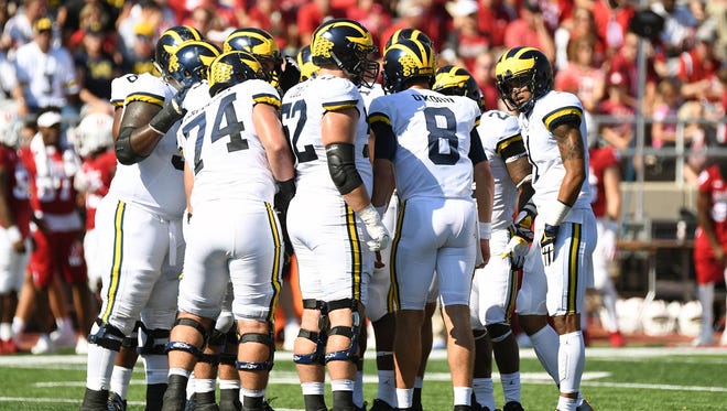 Michigan huddles for a play during the second quarter.