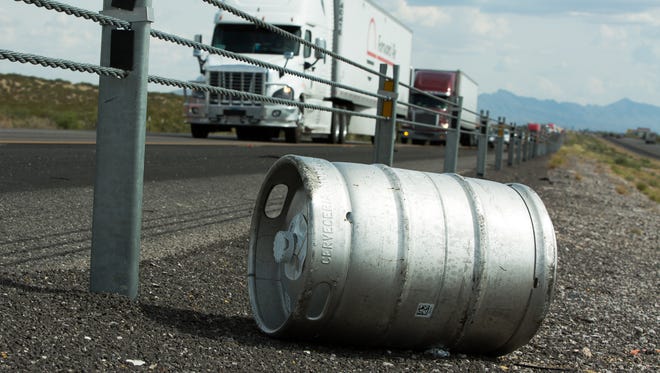 A Modelo keg rolls to the median after two tractor-trailers crashed into a ditch on Tuesday, September 20, 2016, on Interstate 10, near mile markers 148 and 149.