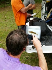 TVA biologist Jeff Simmons photographs a Tennessee