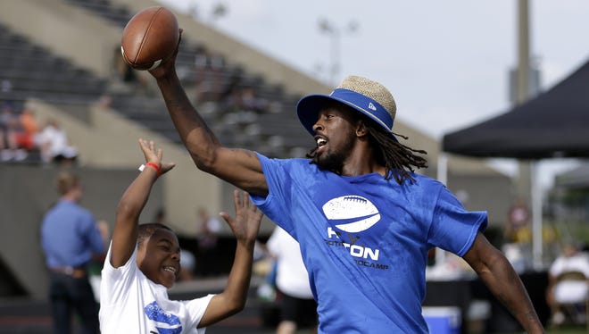 Indianapolis Colts wide receiver T.Y. Hilton, along with prep and college coaches, leads the T.Y. Hilton Football ProCamp with more than 180 area kids in grades one through eight at Lawrence North High School on July 8, 2016.