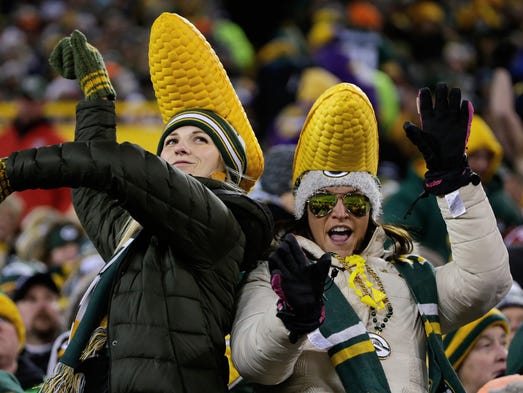 A pair of fans dance in the second half of the Packers-Vikings
