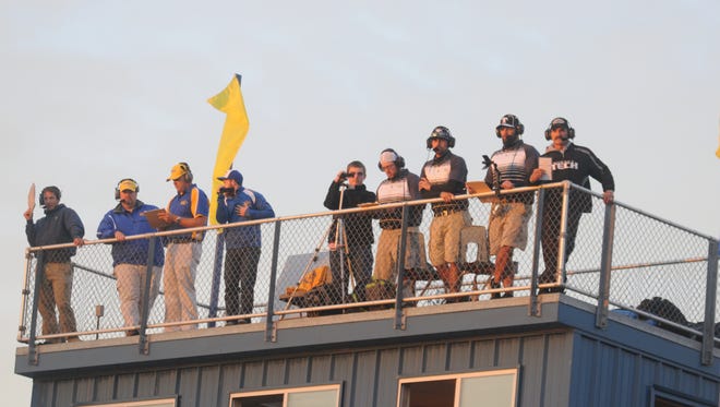 The offensive and defensive coordinators of the Sussex Tech and Sussex Central football teams watch the game from on top of the press box Monday night in Georgetown.