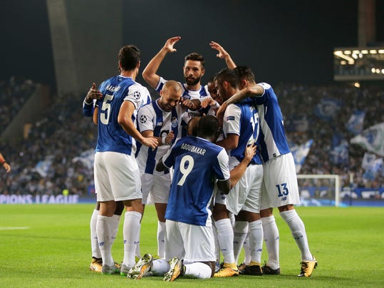 Porto players celebrate after scoring the opening goal during the Champions League group G soccer match between FC Porto and RB Leipzig at the Dragao stadium in Porto, Portugal, Wednesday, Nov. 1, 2017. (AP Photo/Luis Vieira)