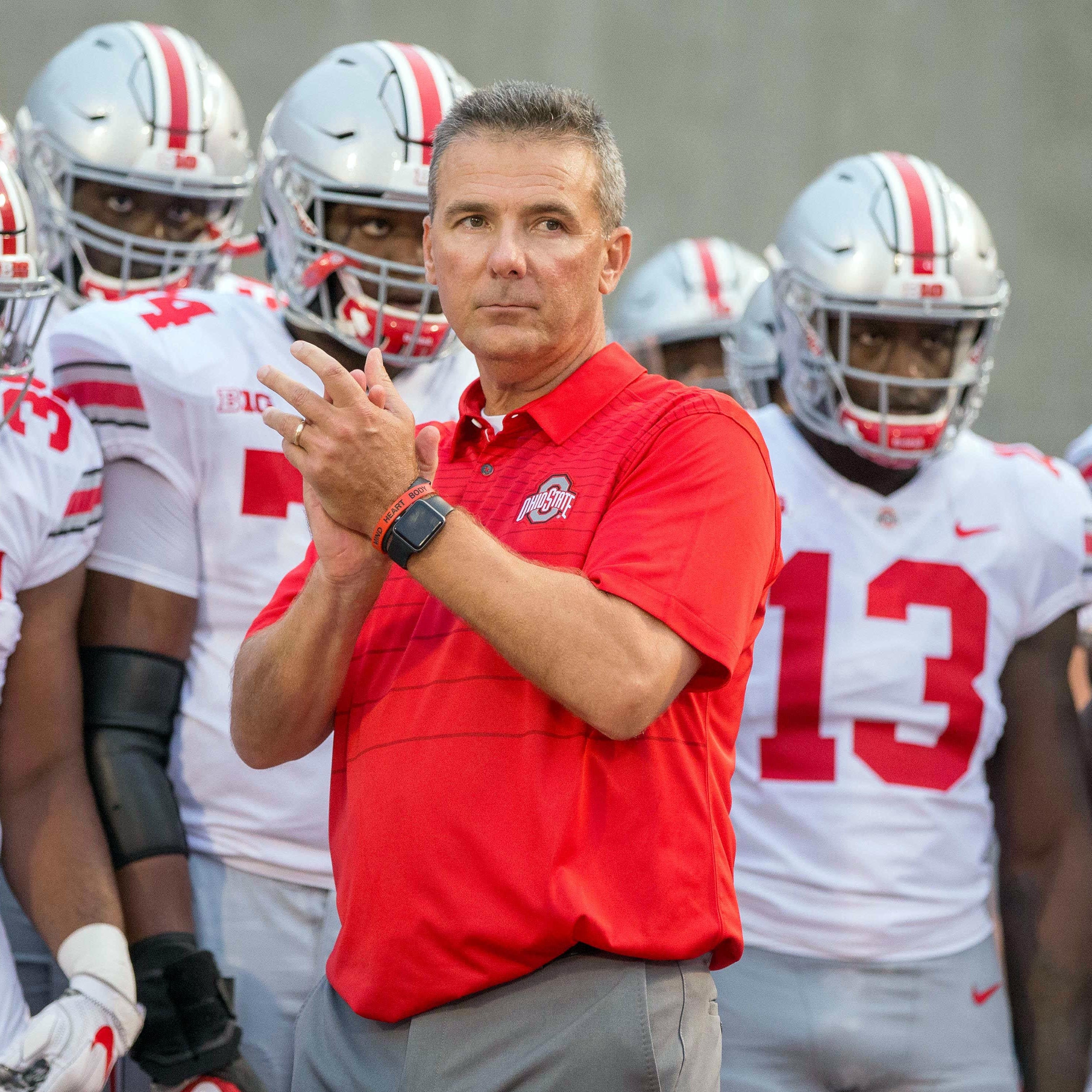 Ohio State coach Urban Meyer and his team prepares to take the field before their game against Indiana in 2017.