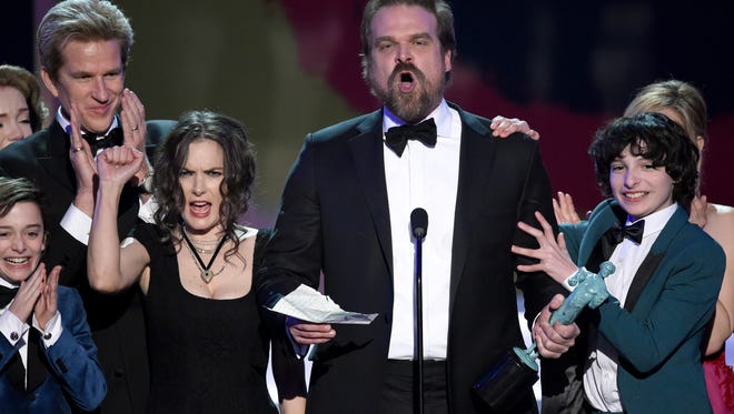 David Harbour and the cast of "Stranger Things" accept the award for outstanding performance by an ensemble in a drama series at the 23rd annual Screen Actors Guild Awards at the Shrine Auditorium & Expo Hall on Sunday, Jan. 29, 2017, in Los Angeles. (Photo by Chris Pizzello/Invision/AP)