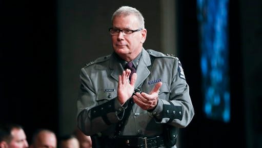 New York State Police Superintendent George Beach II applauds during a state police graduation ceremony at the Empire State Plaza Convention Center on Thursday, Oct. 13, 2016, in Albany, N.Y.