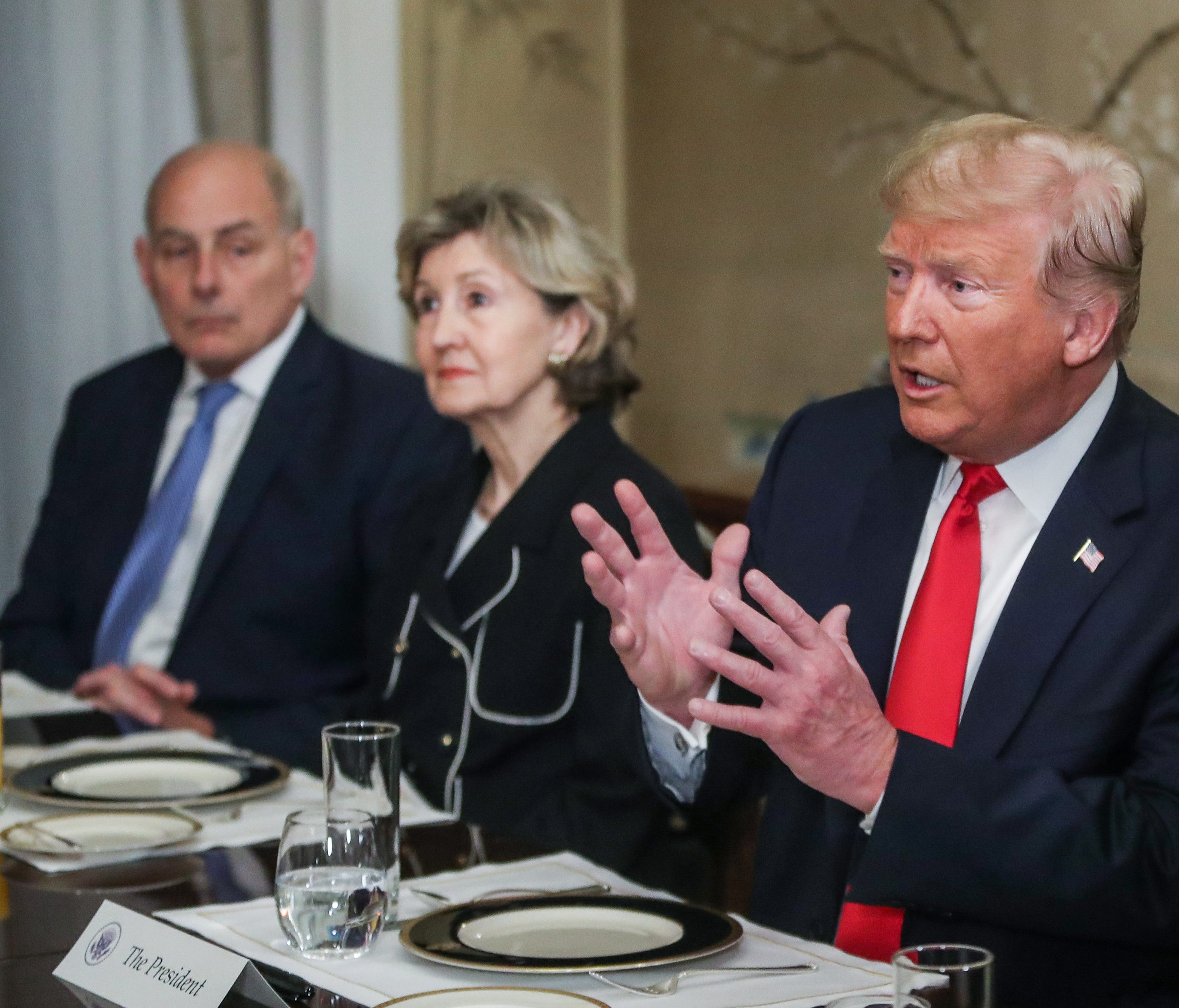 President Donald Trump, NATO ambassador Kay Baily Hutchinson and White House Chief of Staff John Kelly attends a meeting ahead of a NATO Summit, at the U.S. Embassy in Brussels, July 11, 2018.