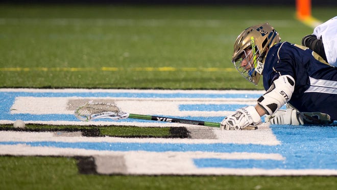 Essex's Willem Barwin stretches to try to corral a faceoff against South Burlington during a boys lacrosse game at South Burlington on Wednesday, April 18, 2017.