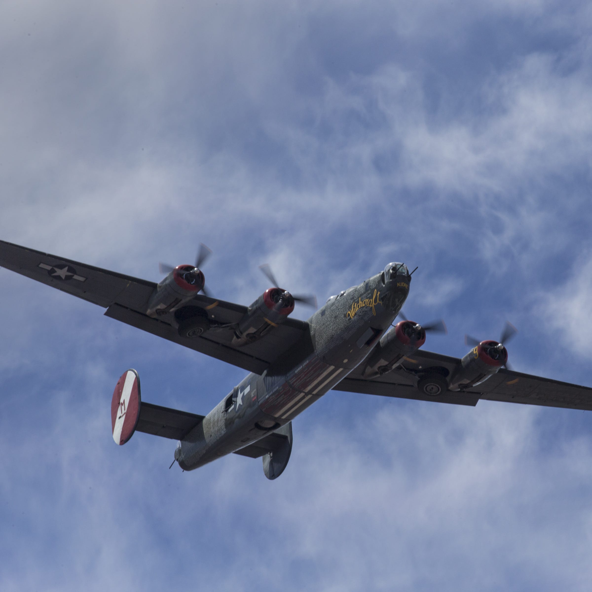A Consolidated B-24 Liberator flies over Deer Valley Airport.