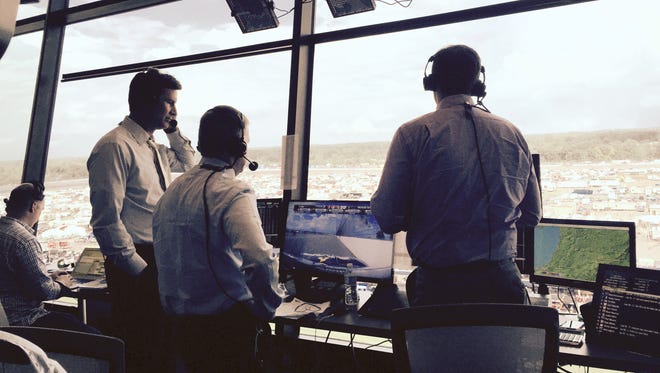 NBC Sports’ crew of Rick Allen, Jeff Burton and Steve Letarte conduct a dry run during last month’s race in Brooklyn, Mich.