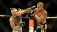 McGregor, left, throws a punch against Dustin Poirier