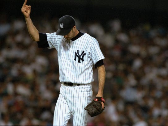 New York Yankees pitcher Jack McDowell gives fans the