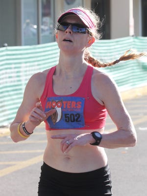 Julie Crutchfield, of Wilminton, IL is the first female to finish the 2016 Hooters Half Marathon on Sunday.