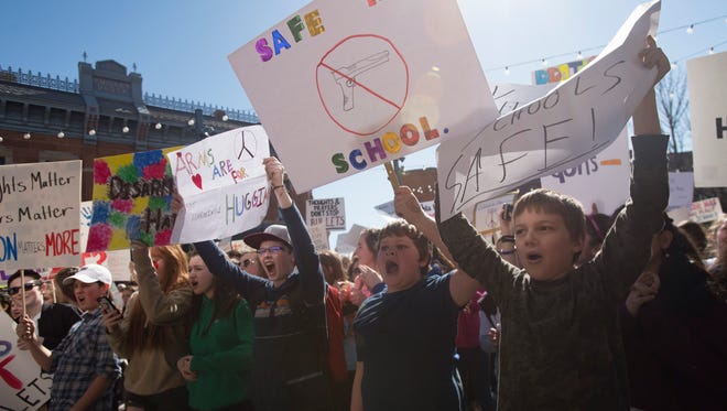 Students from around Fort Collins schools chant in protest as they crowd Old Town Square during a rally voicing concerns about school safety on Tuesday, February 27, 2018. 