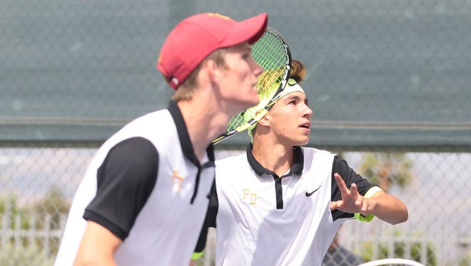 Palm Desert doubles team of Alex Kuperstein and Brad Cummins, front, in action against Peninsula’s Sahm Irvine and Shoma Kishmoto during the second round of the CIF Southern Section playoffs on Thursday in Palm Desert.