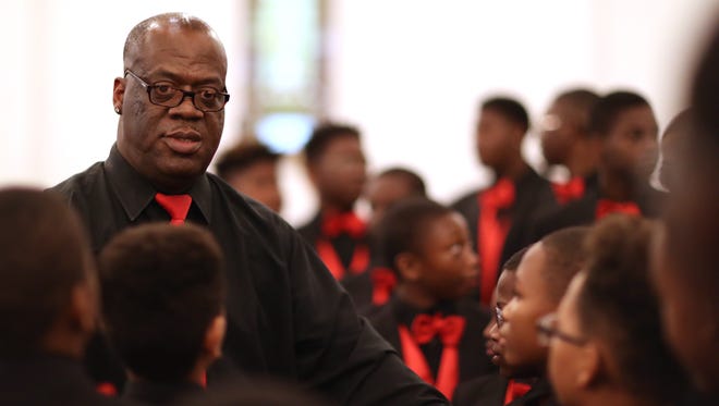 Earle Lee, who has lead the Boys' Choir of Tallahassee for 20 years, takes the helm as they sing in Bethel AME Church on Aug. 29, 2017.