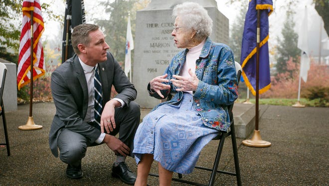 Oregon Department of Veterans' Affairs Director Cameron Smith talks to World War II Army nurse Jean Wojnowski on Friday, Nov. 4, 2016. Wojnowski served as a nurse in the South Pacific and recently turned 101 years old.