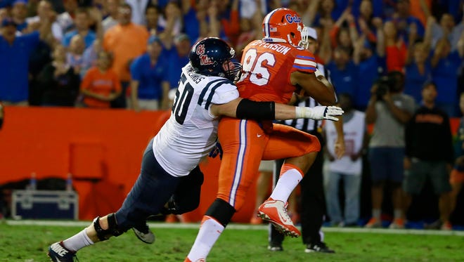 Offensive lineman Sean Rawlings (50) attempts to tackle Florida defensive lineman Cece Jefferson (96). Rawlings is expected to be a versatile member of Ole Miss' offensive line this year.
