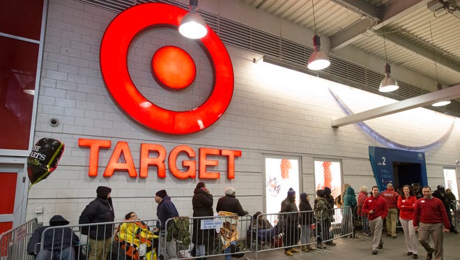 Guests line up outside Target as they wait for the Black Friday sale to begin, Thursday, November 27, 2014, in the Harlem neighborhood of New York.