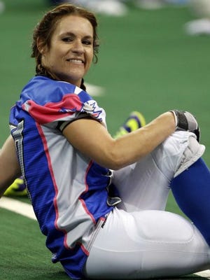 Texas Revolution's Jennifer Welter warms up for the Revolution's Indoor Football League game against the North Texas Crunch on Saturday, Feb. 15, 2014, in Allen, Texas. Welter became what is believed to be the first woman who wasn't a kicker or holder to play in a men's pro football game.