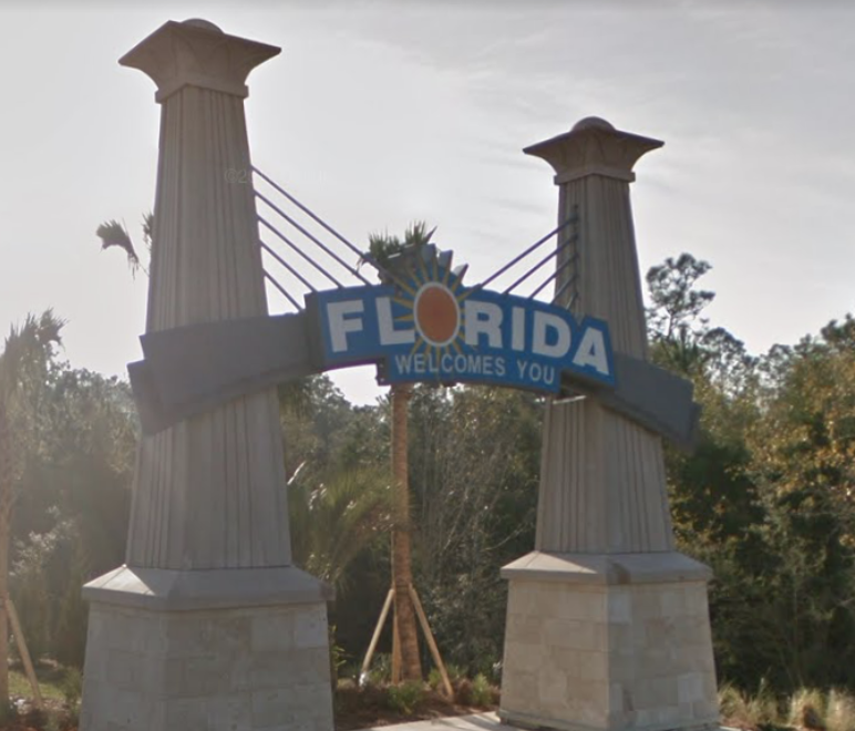 Newly installed in 2015, this bridge-shaped structure featuring bold font and a bright orange sun introduces drivers into Florida's state lines.