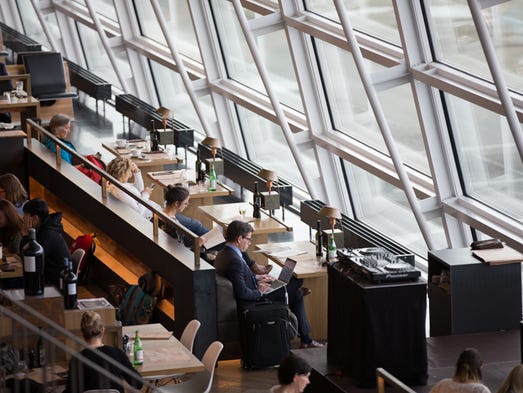 Passengers take a break in the terminal before catching