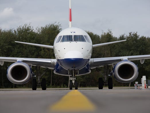 A British Airways Embraer E170 taxis into the gate
