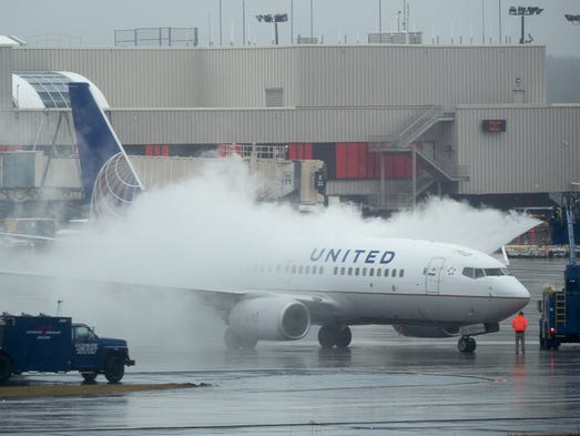 A United Airlines jet is treated with de-icing fluid
