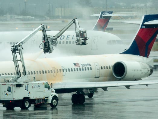 Delta Air Lines jets are treated with de-icing fluid