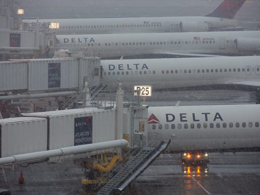Delta Air Lines jets at airport amid wintry conditions