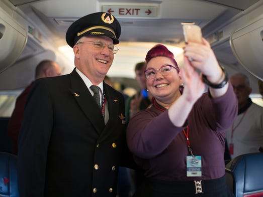 Delta Air Lines Capt. Paul Gallaher and Delta employee