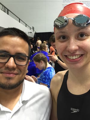 Lowell swimmer Anya Goeders, right, with her Mako Swim Team coach, Jarrod Hunte.
