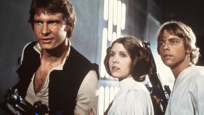 Harrison Ford, left to right, Carrie Fisher and Mark Hamill starred in the original "Star Wars" in 1977.