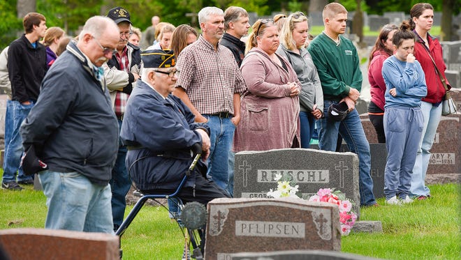 The names of veterans are read during a Memorial Day ceremony at the St. John's Abbey Cemetery May 29, 2017 in Collegeville.