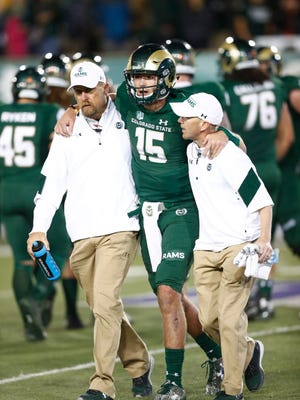Colorado State Rams quarterback Collin Hill (15) is helped off the field after being injured in the second half of an NCAA college football game late Saturday, Oct. 8, 2016, in Fort Collins, Colo. Colorado State won 31-24. (AP Photo/David Zalubowski)
