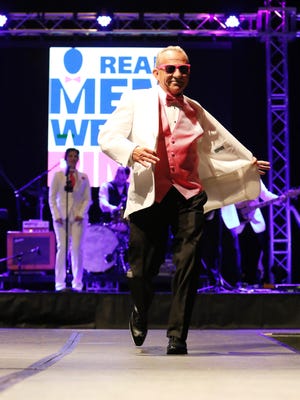 Mike Johnson modeled for Real Men Wear Pink during the 23rd Annual Rock the Runway event at the Carl Perkins Civic Center in Jackson on October 3, 2017.