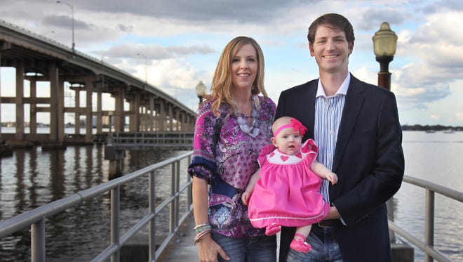 Dr. Eric and Melissa Eason with their daughter, Julianna