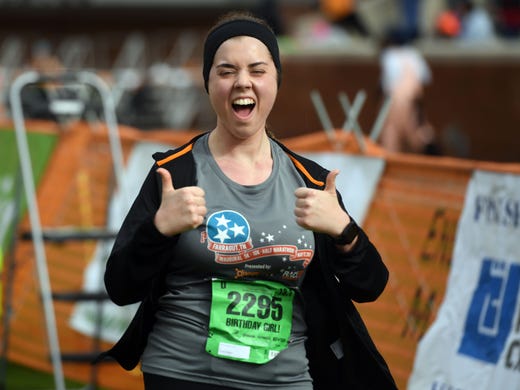 Abby Gallaher celebrates as she crosses the finish