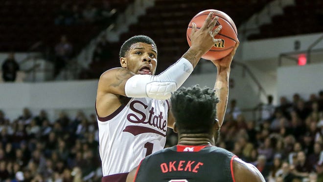 Mississippi State guard Lamar Peters (1) shoots around Nebraska center Duby Okeke (0) during the second half of an NIT first round college basketball game in Starkville.