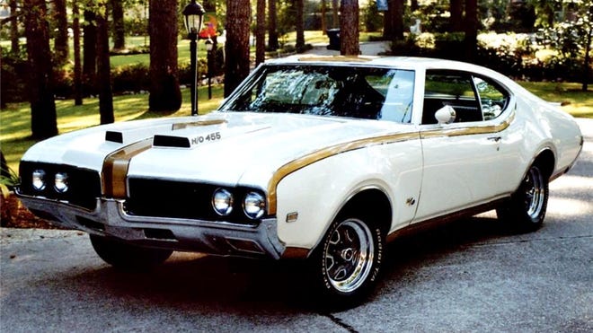 The 1969 Hurst Olds 442 is one of the more desirable muscle cars from the 1960s. Both featured 455-inch Rocket V8s with 390 horsepower. Only 515 were built in 1968 and 906 were assembled in 1969. This 1969 came only in white and gold, while the 1968 featured a black and silver motif.