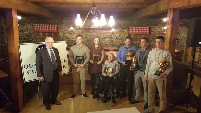 The Quarterback Club of York honored a number of York-Adams athletes on Monday night. Pictured, from left, are: QB Club of York president Roy Robbins, Nick Erickson (Spring Grove), Tessa Myers (Dallastown), Emma Leik (York Suburban), Jake Jansen (Dallastown), Thomas Merkle (York Suburban) and Kyle Krout (Hanover).