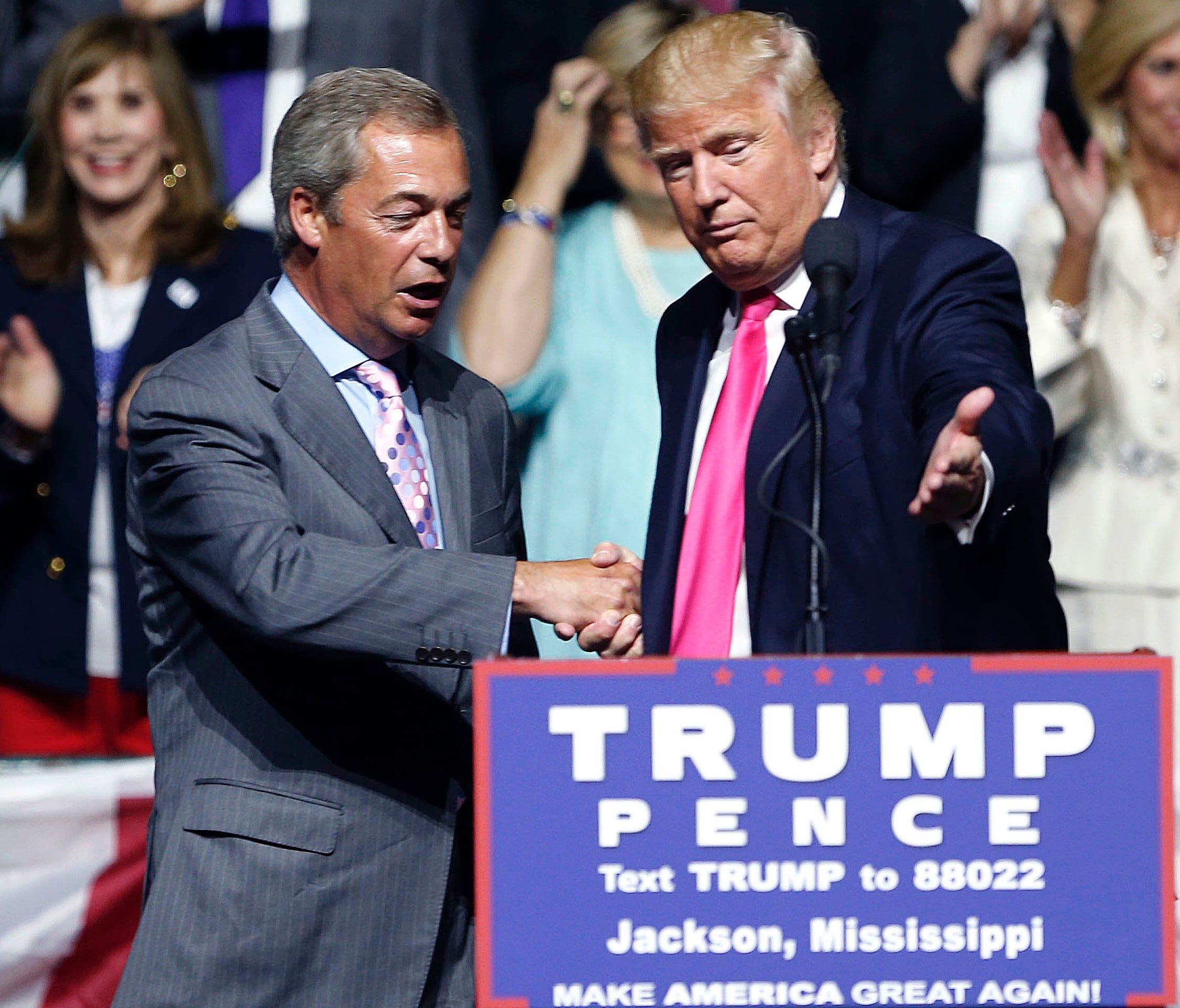 In this is a Wednesday, Aug. 24, 2016 file photo, the now President-elect Donald Trump welcomes pro-Brexit British politician Nigel Farage, to speak at a campaign rally in Jackson, Miss.