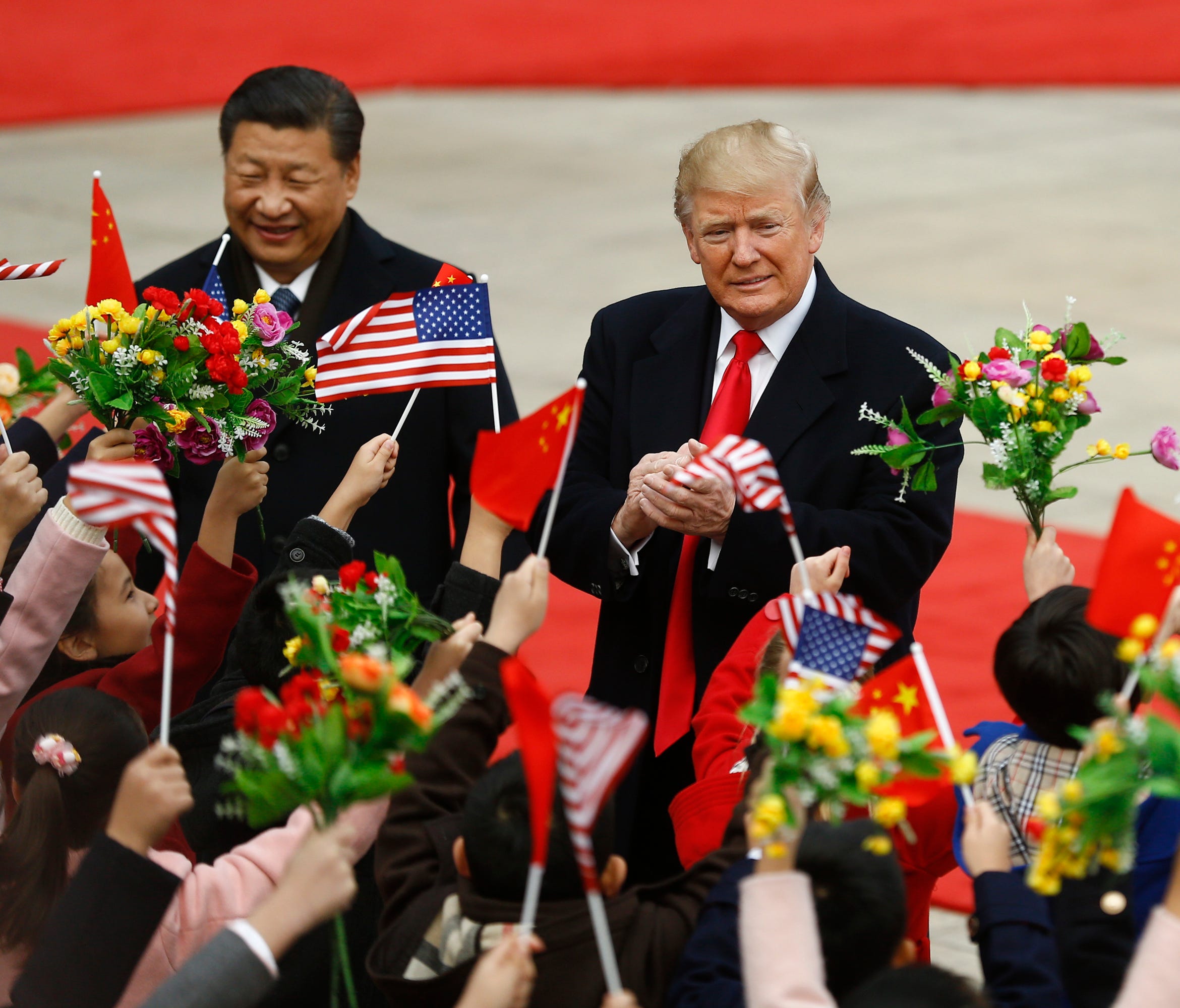 Chinese President Xi Jinping, left,  and President Donald Trump attend a welcoming ceremony Nov. 9, 2017 in Beijing, China. Trump is on a 10-day trip to Asia.