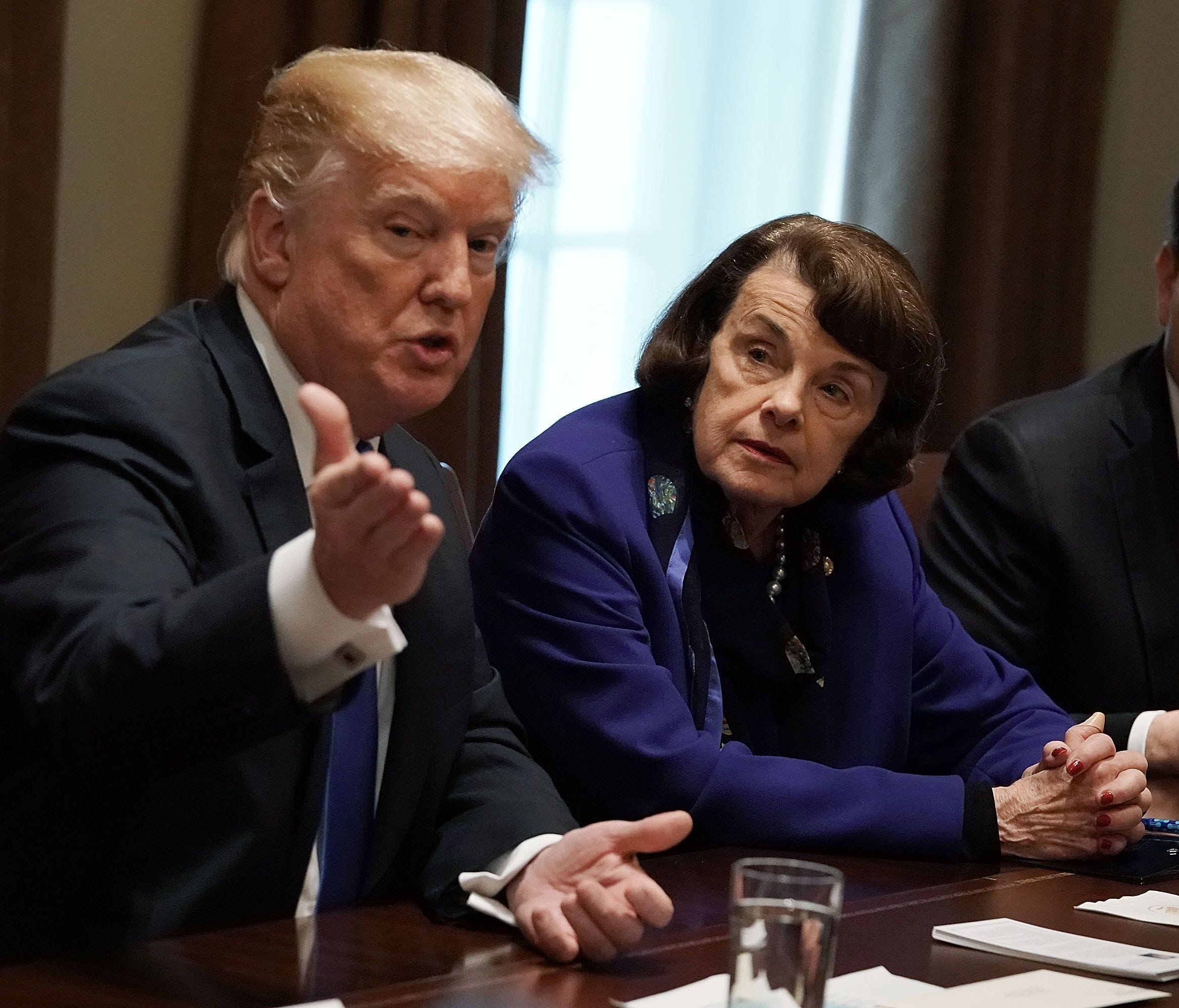 President Donald Trump speaks as Sen. Dianne Feinstein (D-CA), Sen. Marco Rubio (R-FL) and Rep. Ted Deutch (D-FL) listen during a meeting with bipartisan members of the Congress at the Cabinet Room of the White House February 28, 2018 in Washington, 