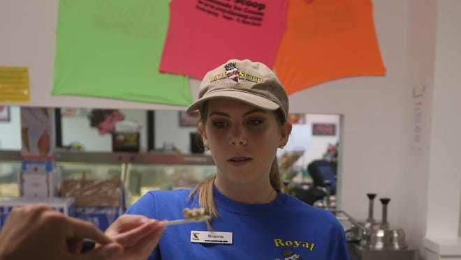 Brianna Toadvine, 16, scoops some “Sticky Fingers” free ice cream as part of Royal Scoop Homemade Ice Cream’s new flavor contest on Thursday June 29.
