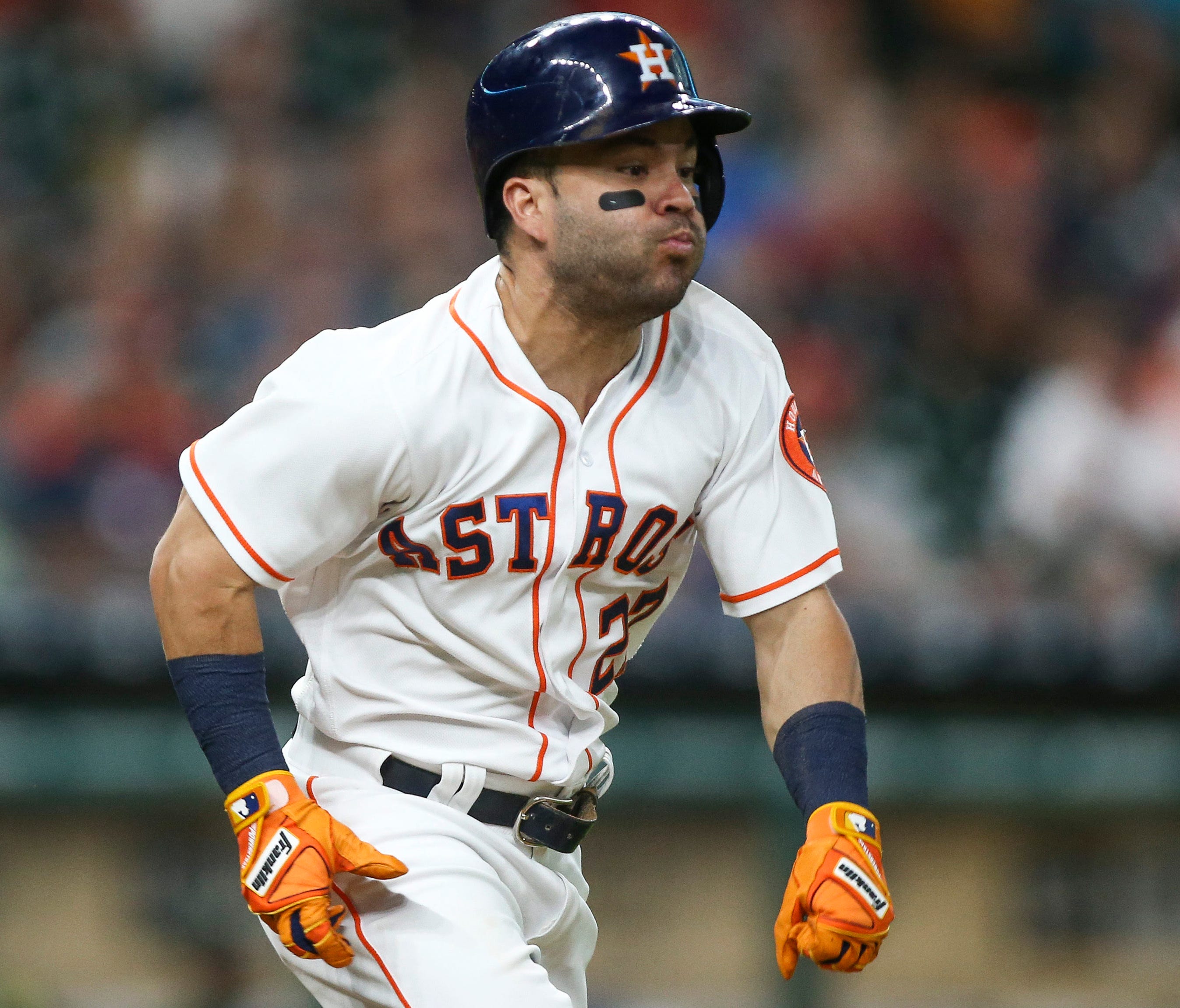 Houston Astros second baseman Jose Altuve hits an infield single during the third inning against the Oakland Athletics at Minute Maid Park.