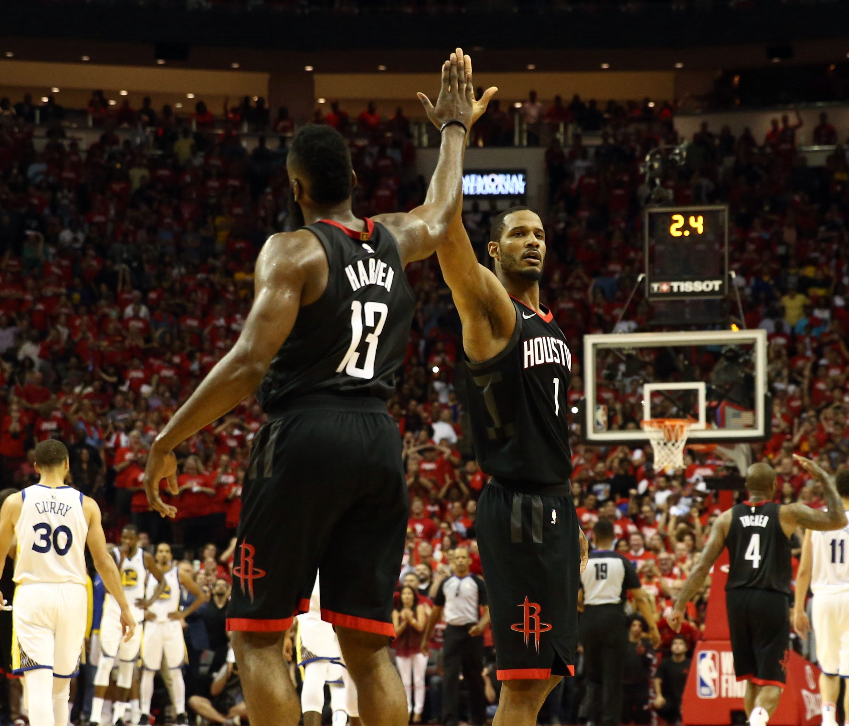 Houston Rockets guard James Harden and forward Trevor Ariza high-five during the fourth quarter of Game 5.