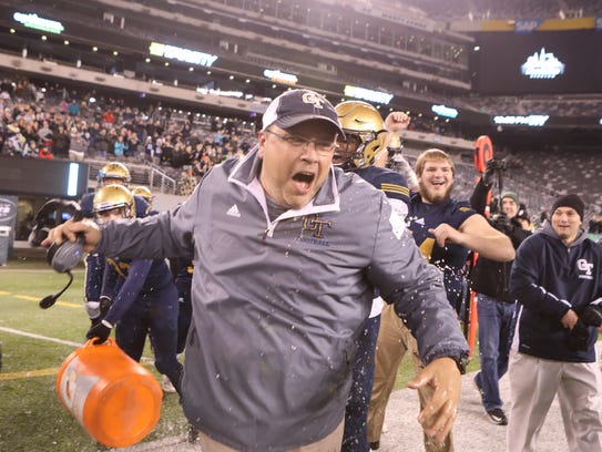 Old Tappan Assistant Coach, Pete Dunn is doused with
